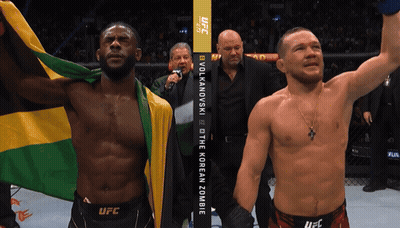 Two Men Fighting In Ring With Bodyarmor Sign GIF