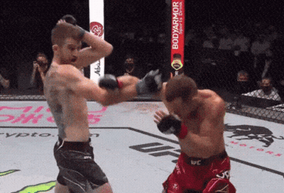 Two Men Fighting In Ring With BodyArmor Sports Drink Sign GIF