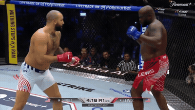 Two Men Fighting in Ring With Paramount Banner