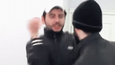 Two Men Fighting In Room GIF