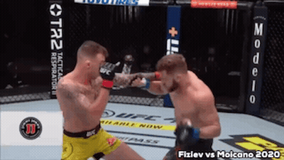 Two Men Fighting In UFC Boxing Ring GIF