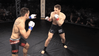 Two Men Fighting In UFC Ring GIF