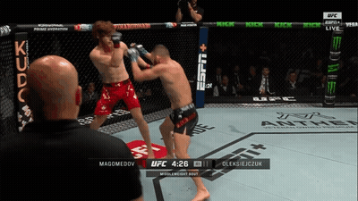Two Men Fighting In UFC Ring GIF