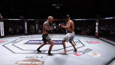 Two Men Fighting In UFC Ring Sponsored By Harley-Davidson And Toyo Tires GIF