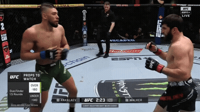 Two Men Fighting In UFC Ring With Monster Energy Logo GIF