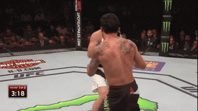 Two Men Fighting In UFC Ring With Monster Energy Sign GIF