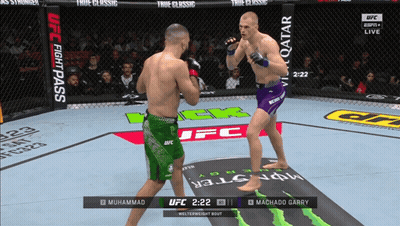 Two Men Fighting In UFC Ring With UFC Fight Pass Logo GIF
