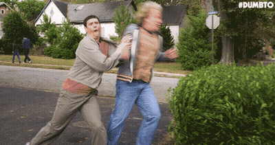 Two Men Fighting On Road With Dumbto GIF