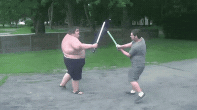 Two Men Fighting With Lightsabers GIF