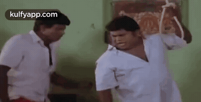 Two Men Fighting With Stick GIF