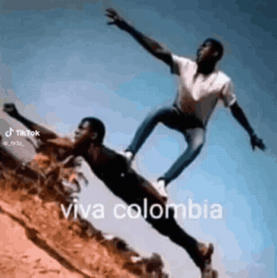 Two Men Flying Viva Colombia GIF