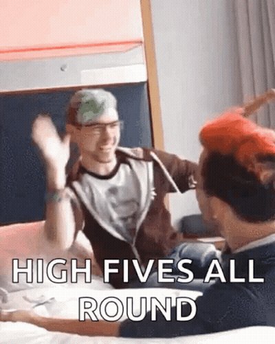 Two Men Giving Each Other A High Five GIF