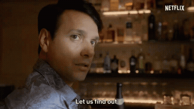 Two Men High-Fiving In Front Of Netflix Logo GIF