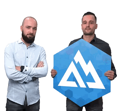 Two Men Holding Blue Sign With White Triangle Sticker