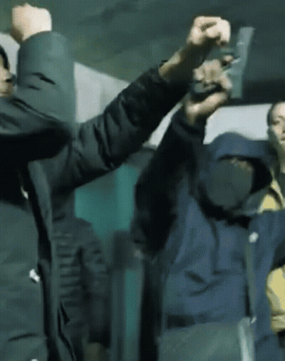 Two Men Holding Guns Right And Left GIF