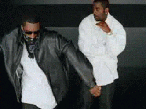 Two Men Holding Hands GIF