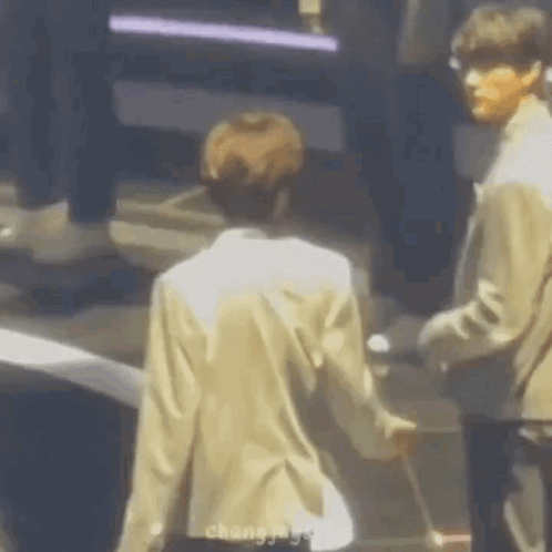Two Men Holding Hands GIF