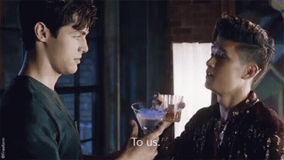 Two Men Holding Martini Glass Talking GIF