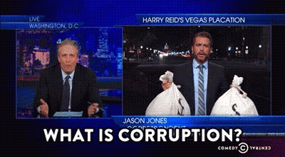 Two Men Holding Money Bags Saying What Is Corruption GIF