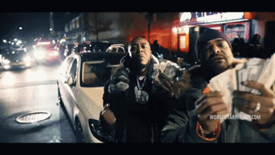 Two Men Holding Money In Front Of A Car With The Website Worldstarhiphop.com Visible GIF