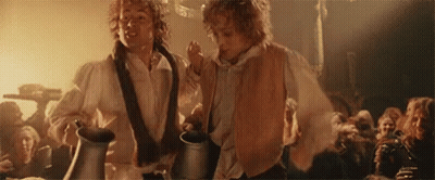 Two Men Holding Pitchers In A Crowd GIF