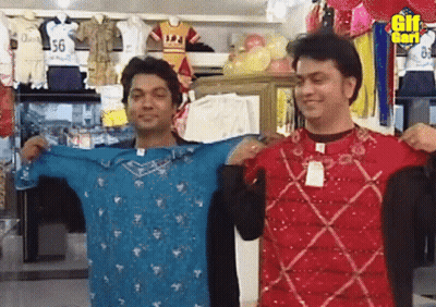 Two Men Holding Shirts In Front Of GIF Sign GIF