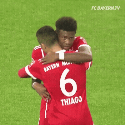Two Men Holding Shirts With Nacho And Thiago GIF