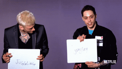 Two Men Holding Signs Saying Juggling And Juggler GIF