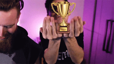 Two Men Holding Tessa Trophy GIF