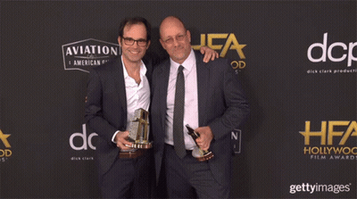 Two Men Holding Trophies Aviation And American Gin GIF
