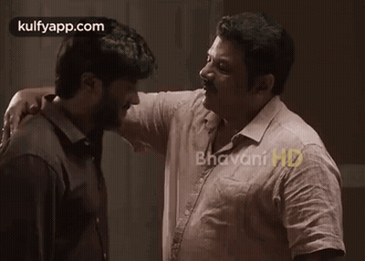 Two Men Hugging And Kissing On Cheek GIF