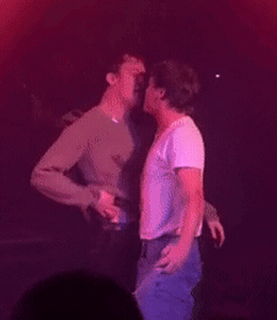 Two Men Hugging And Kissing On Stage GIF