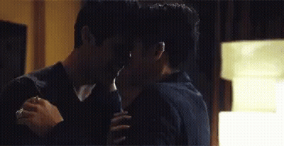 Two Men Hugging And Kissing GIF