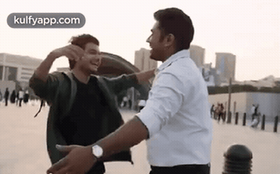 Two Men Hugging And Laughing GIF