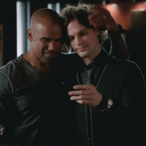 Two Men Hugging And Looking At Cell Phone GIF