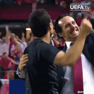 Two Men Hugging At Soccer Game GIF