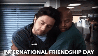 Two Men Hugging Each Other In A Hospital With The Words International Friendship Day Below Them GIF