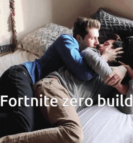 Two Men Hugging Each Other On A Bed With The Words Fortnite Zero Build GIF