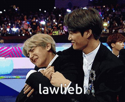 Two Men Hugging Each Other With The Words Lawliebi Written On The Bottom GIF