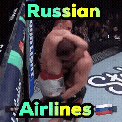 Two Men Hugging In Boxing Ring Russian Airlines GIF