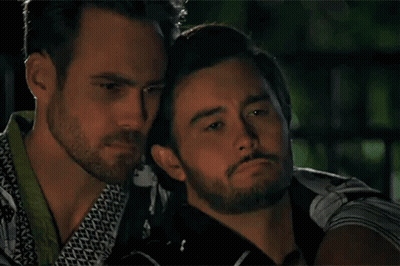 Two Men Hugging In Dark Room GIF