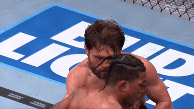 Two Men Hugging In Front Of Bud Light Sign GIF