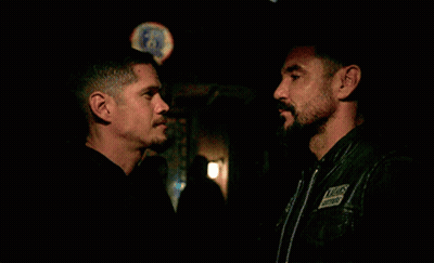 Two Men Hugging In Front Of Bud Light Sign GIF