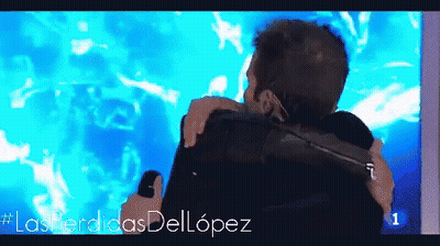 Two Men Hugging In Front Of #Lasperdidasdellopez GIF