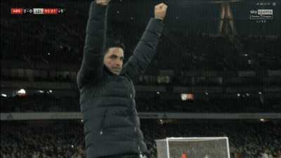 Two Men Hugging In Front Of Sky Sports Premier League Live Screen GIF