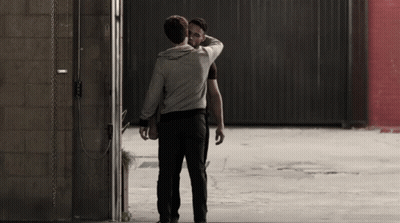 Two Men Hugging In Parking Lot GIF