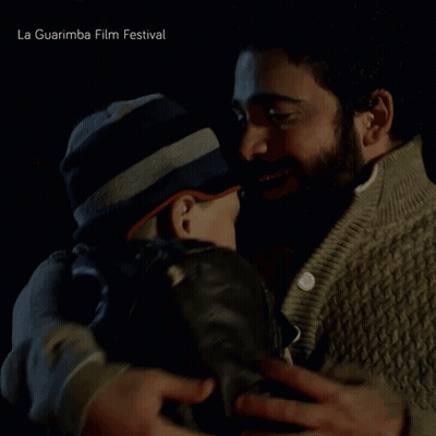 Two Men Hugging La Guarimba Film Festival GIF