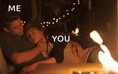 Two Men Hugging Near Fire GIF