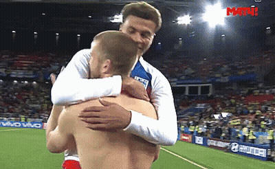 Two Men Hugging On Soccer Field Saying Match GIF