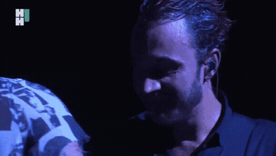 Two Men Hugging One Wearing Hi Shirt GIF